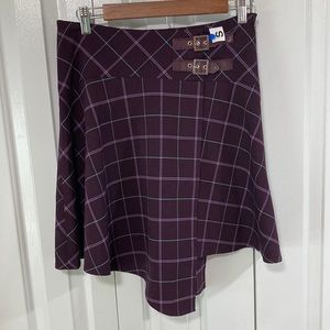 Gently used but in excellent condition size 4 Bebe purple plaid skirt.